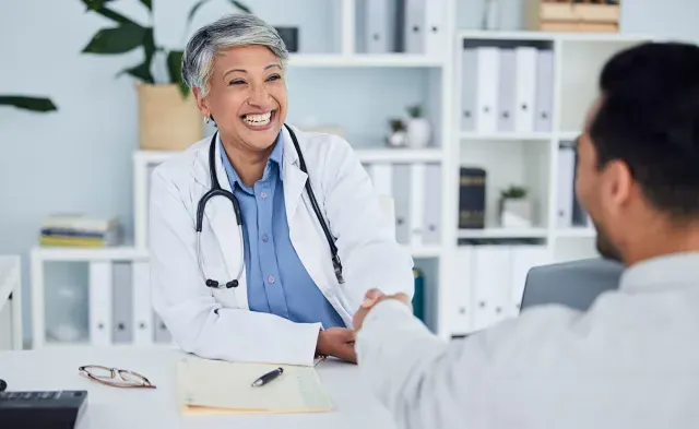 Public Health Nurse Shaking Hands with Nurse Manager